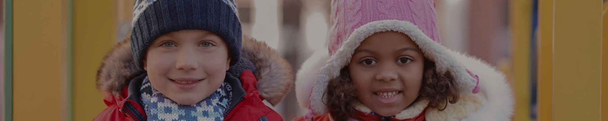 Kids in warm coats and hats